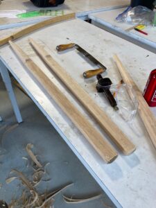 The uprights, rough shaped but not yet steam bent. (A draw knife, my best friend for the week, is off to the right.)
